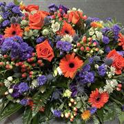 Orange and Purple casket spray