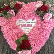 Pink artificial heart with message